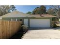 This home features an attached two car garage and fenced in yard with additional off street parking at 10370 Sw 110Th St, Dunnellon, FL 34432