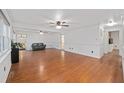 Spacious living room with hardwood floors, neutral walls, and classic trim at 11 Se 31St St, Ocala, FL 34471