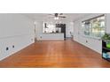 Open-concept living space leading to a modern kitchen with sleek countertops at 11 Se 31St St, Ocala, FL 34471