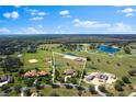 Spacious property showcasing a luxurious home and beautiful surroundings including ponds at 12424 Sw 140Th Loop, Dunnellon, FL 34432