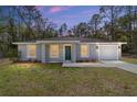 Charming single-story home with a well-manicured lawn and attached one-car garage at 13396 Sw 105 Pl, Dunnellon, FL 34432
