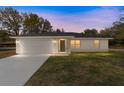 Well-lit single-story home with an attached two-car garage and a neatly prepped lawn at 13495 Sw 114Th Ln, Dunnellon, FL 34432