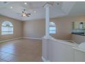Bright living room with tile flooring, ceiling fan, and lots of natural light at 5916 Nw 27Th Pl, Ocala, FL 34482