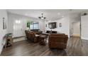 Comfortable living room with a large window, hardwood floors, and stylish furnishings at 6125 Se 11Th St, Ocala, FL 34472