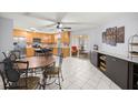 Bright kitchen featuring ample counter space, oak cabinets, stainless steel appliances, and a tiled floor at 9770 Sw 97Th Pl, Ocala, FL 34481