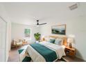 Serene main bedroom with natural light, a ceiling fan, and stylish decor at 10069 Sw 140Th Ave, Dunnellon, FL 34432