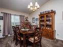 Elegant dining room featuring a large wooden table and a vintage china cabinet at 4941 Nw 32 Street, Ocala, FL 34482