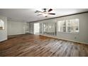 Spacious living room with wood floors, ceiling fan, and lots of natural light at 9025 Sw 94Th Ln # C, Ocala, FL 34481
