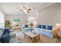 Bright and airy living room featuring neutral walls, ceiling fan, and comfortable seating at 15428 Sw 60Th Cir, Ocala, FL 34473
