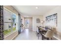 Bright dining room features large windows, stylish decor, and a modern dining set with seating for six at 2171 Ne 28Th Ln, Ocala, FL 34470