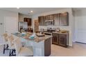 Open kitchen featuring granite countertops, a breakfast bar with seating and stainless steel appliances at 2940 Ne 21St Terrace Rd, Ocala, FL 34470