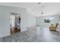 Bright living room with modern flooring, fan, and natural light at 5347 Nw 20Th Pl, Ocala, FL 34482