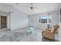 Bright living room with modern flooring, fan, and natural light at 5347 Nw 20Th Pl, Ocala, FL 34482