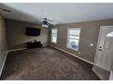 Spacious living room with new carpet and bright windows at 5520 Nw 57Th St, Ocala, FL 34482