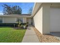 Inviting front entrance with a walkway lined with decorative stones and lush landscaping at 7 Fir Drive Trce, Ocala, FL 34472