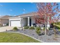 Charming single-story home with landscaped yard, stone accents, and covered entryway at 7698 Sw 85Th Cir, Ocala, FL 34481