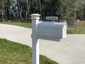Close-up of a white mailbox with the house number '1645' displayed on a black plate at 1645 Sw 168Th Loop, Ocala, FL 34473