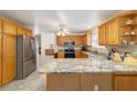 Spacious kitchen with stainless steel appliances, granite countertops, and ample cabinet space at 17959 Se 89Th Natchez Ave, The Villages, FL 32162