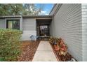 Inviting front entrance featuring a beautifully landscaped walkway leading to the decorative front door at 1902 Se 37Th Court Cir, Ocala, FL 34471