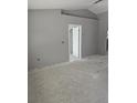 Unfinished living room with freshly painted walls and a doorway leading to other rooms at 1929 Sw 7Th Pl, Ocala, FL 34474