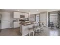 Well-lit kitchen boasts stainless steel appliances, granite counters, and a convenient center island with bar stool seating at 2934 Ne 21St Terrace Rd, Ocala, FL 34470