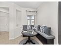 Cozy breakfast nook with a built-in bench and decorative pillows next to a window at 5870 Sw 93Rd Cir, Ocala, FL 34481