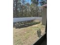 View of the backyard with a white privacy fence, offering a private outdoor space at 6884 Sw 149Th Lane Rd, Ocala, FL 34473