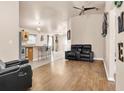 Open-concept living room with wood floors, modern furnishings, and seamless flow to the kitchen at 811 Niles St, Daytona Beach, FL 32114