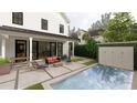 Inviting backyard featuring a modern pool, spacious patio, and elegant water feature at 912 Se 6Th St, Ocala, FL 34471