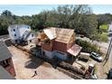 Aerial view of new home construction, showing framing details and the surrounding neighborhood at 912 Se 6Th St, Ocala, FL 34471
