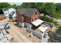 New home under construction, showcasing foundation, walls, and construction equipment on a sunny day at 912 Se 6Th St, Ocala, FL 34471