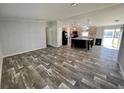 Modern kitchen featuring a large island with seating, stainless steel appliances, and updated cabinets at 11644 Nw 21St St, Ocala, FL 34482