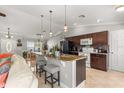 Kitchen featuring granite countertops, an island with seating, and stainless steel appliances at 1192 Ne 130Th Ter, Silver Springs, FL 34488