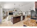 Open kitchen layout with granite countertops, stainless steel appliances, and seamless flow to living area at 1192 Ne 130Th Ter, Silver Springs, FL 34488