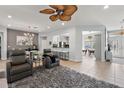 Spacious living area with comfortable seating, opening to the dining area and kitchen at 12139 Se 91St Ter, Summerfield, FL 34491
