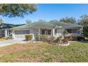 Charming single-story home with a two-car garage, and well-maintained front yard at 9581 Sw 85Th Ave # D, Ocala, FL 34481