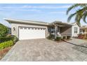 Charming home with well-kept lawn, lovely landscaping, and paved driveway leading to the two-car garage at 9974 Sw 88Th Loop, Ocala, FL 34481