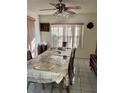 Traditional dining room featuring a large table with seating and tile floors at 10 Hickory Loop, Ocala, FL 34472