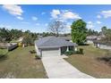 Attractive single-story residence with a two-car garage, landscaped front yard, and a charming, Gathering-friendly neighborhood at 10400 Sw 50Th Ct, Ocala, FL 34476