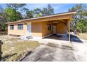 Single-story home boasting a convenient, attached covered carport, providing protection from the elements at 1533 Pine St, Apopka, FL 32703