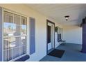 Inviting front porch featuring a calming color scheme, decorative touches and ample natural light at 5037 Sw 109Th Loop, Ocala, FL 34476
