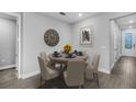 Dining room featuring a decorative clock and a table set for six people at 5270 Nw 33Rd Pl, Ocala, FL 34482