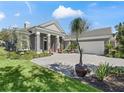Charming single-story home showcasing the beautifully patterned driveway and manicured front lawn at 8033 Nw 28Th St, Ocala, FL 34482