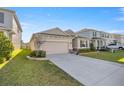 Well-maintained home with a spacious driveway and manicured lawn in a desirable neighborhood at 8899 Sw 50Th Ave, Ocala, FL 34476
