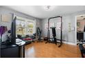 Bright room with fitness equipment and plenty of natural light coming through the window at 12453 Se 61St Ct, Belleview, FL 34420