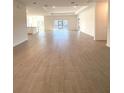 Expansive living room featuring sleek tile flooring, recessed lighting, and an abundance of natural light at 19444 Sw 78Th Pl, Dunnellon, FL 34432