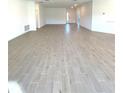 Vast living room featuring sleek tile flooring, recessed lighting, and a bright and airy atmosphere at 19444 Sw 78Th Pl, Dunnellon, FL 34432