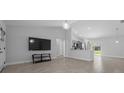 Spacious living area features tiled floors, a ceiling fan, and ample natural light at 3010 Sw 137Th Pl, Ocala, FL 34473