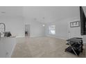Bright open-concept area boasts tile flooring and modern fixtures at 3010 Sw 137Th Pl, Ocala, FL 34473