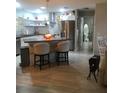 Eat-in kitchen with stainless appliances and stylish countertop seating at 509 Del Mar Dr, Lady Lake, FL 32159